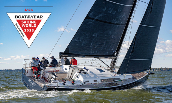 Sailboat on water with award badge visible.