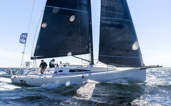 Sailboat navigating on a sunny day.