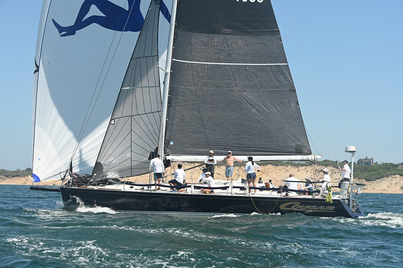 Sailboat with crew in open water.