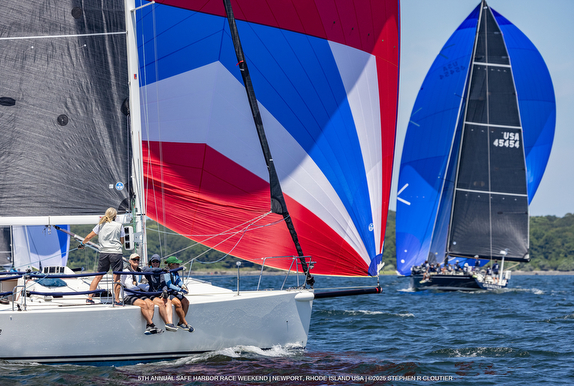 Sailboats racing with colorful spinnakers.