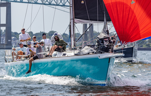 Sailboat with crew during a race.