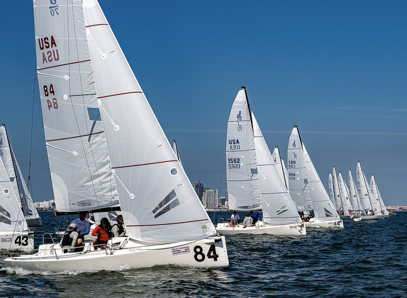 Sailboats racing on a sunny day.