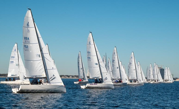 Sailboats racing on a clear blue day.