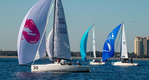Sailboats racing on a sunny day.